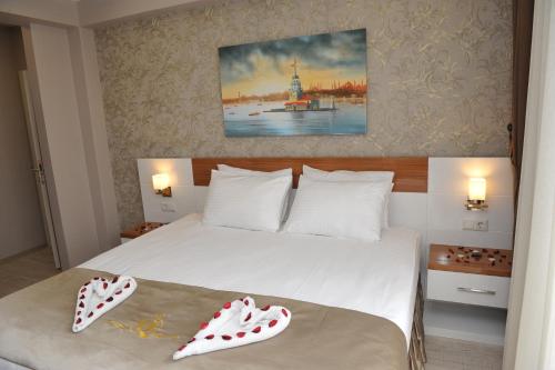 Ένα ή περισσότερα κρεβάτια σε δωμάτιο στο Qamar Prestige Suites