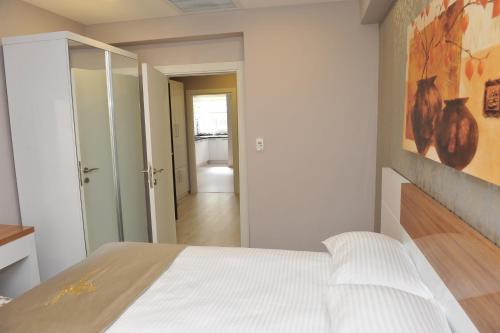 Ένα ή περισσότερα κρεβάτια σε δωμάτιο στο Qamar Prestige Suites