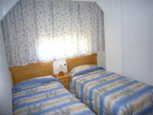 Postel nebo postele na pokoji v ubytování Miramar Playa - Fincas Arena