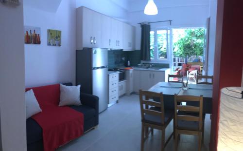 A kitchen or kitchenette at Mirtos Apartments