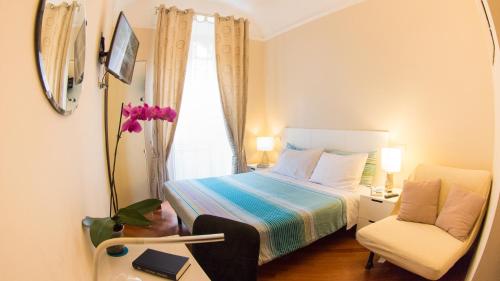 מיטה או מיטות בחדר ב-Hotel Martino Ai Monti