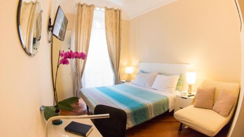 Postel nebo postele na pokoji v ubytování Hotel Martino Ai Monti