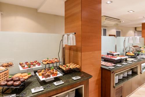 a buffet line with many different types of food at Exe León in León