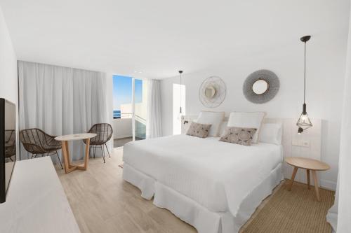 A bed or beds in a room at Barceló Portinatx - Adults Only