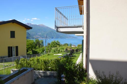 a balcony with a view of the ocean at Orchidea Apartment in Bellagio