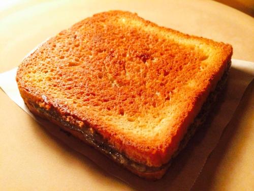 a grilled cheese sandwich sitting on a plate at Hotel Sukoon in Dehradun