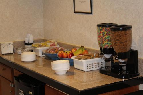 a kitchen counter with a blender and some food at America's Best Value Inn Conyers in Conyers