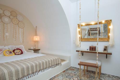 a bedroom with a swinging bed and a mirror at Gorgona Traditional 1 in Karpathos Town