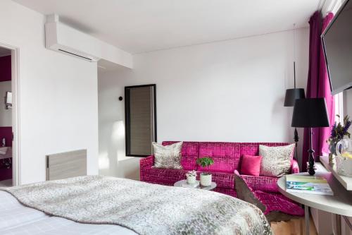 Postel nebo postele na pokoji v ubytování Andersen Boutique Hotel