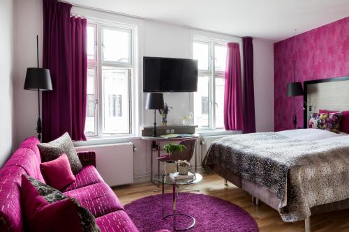 Postel nebo postele na pokoji v ubytování Andersen Boutique Hotel