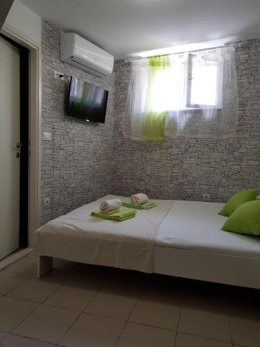 Ένα ή περισσότερα κρεβάτια σε δωμάτιο στο Micro Rooms