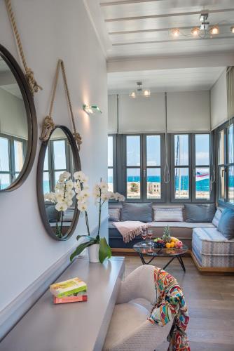 a living room with a couch and a table at Ambassadors Residence Boutique Hotel in Chania Town