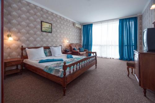 Postel nebo postele na pokoji v ubytování Mercury Hotel-Premium All Inclusive