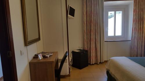 Ένα ή περισσότερα κρεβάτια σε δωμάτιο στο Hotel La Residencia