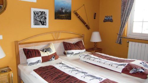 a bedroom with two beds and a window at Can Ronia in Tossa de Mar