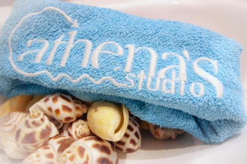 a blue towel sitting on top of some shells at Athena's Studios in Polykhrono