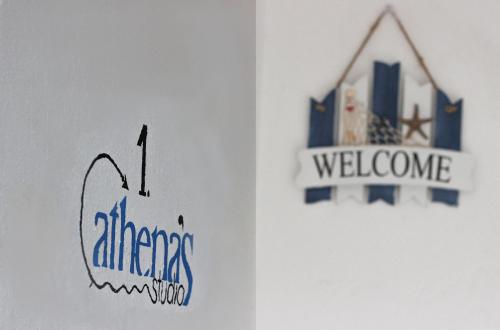 a door with a sign and a welcome sign on it at Athena's Studios in Polykhrono