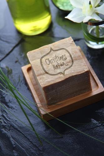 a wooden cutting board with a cake on a table at Gut Sonnberghof in Mittersill