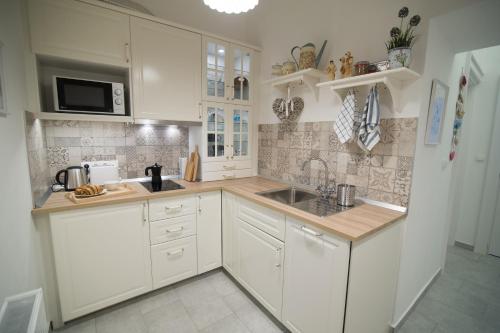 Kuchyňa alebo kuchynka v ubytovaní Bródy Apartman