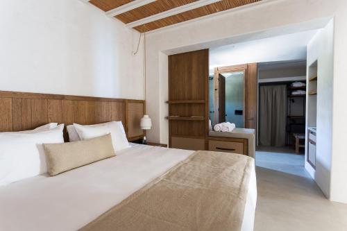 Кровать или кровати в номере Branco Mykonos