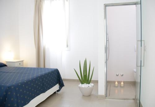 Postel nebo postele na pokoji v ubytování Eco Apartments Cervia