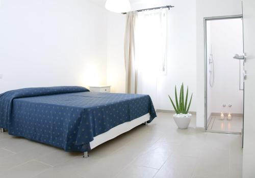 Postel nebo postele na pokoji v ubytování Eco Apartments Cervia