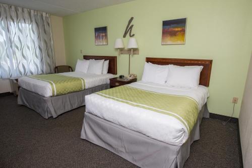 A bed or beds in a room at Hope Hotel and Richard C. Holbrooke Conference Center