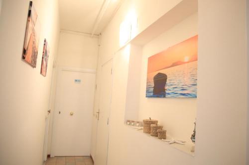 a hallway with a painting on the wall at Il Viaggiatore Serapo in Gaeta