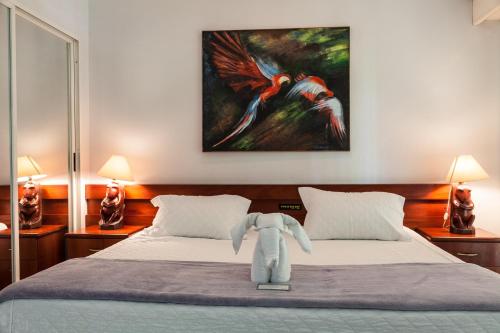 a bedroom with a bed with an elephant on it at Hotel Parque Das Primaveras in Caldas Novas