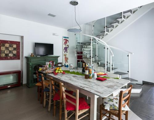 a kitchen with a large table and chairs at Villa Maria in Turin