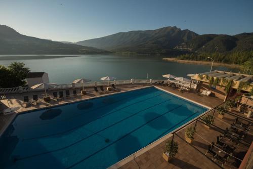 a large swimming pool with a view of a lake at Hotel Terradets in Cellers
