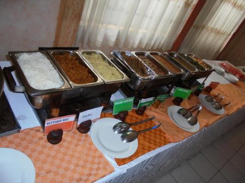 a table topped with different types of food at Adventist LMS Guest House & Conference Centre in Nairobi