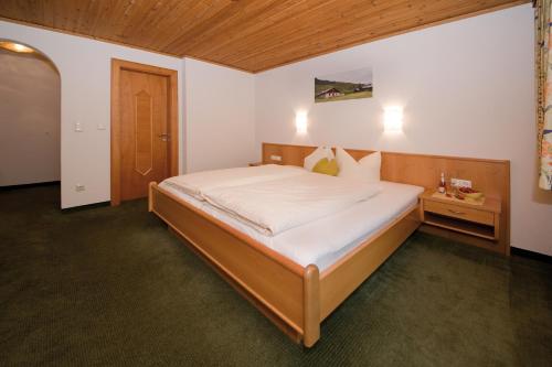 Voodi või voodid majutusasutuse Garni-Austria Kappl toas