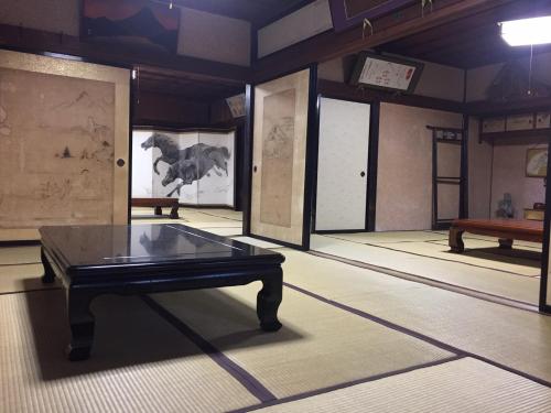 a ping pong table in the middle of a room at Daikokuya Mt.Fuji in Fujiyoshida