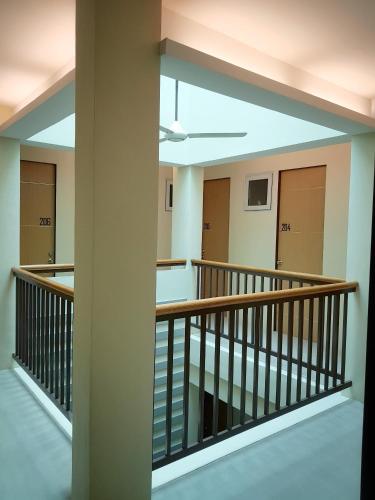 a view of the second floor hallway of a building at The Leaf House in Manila