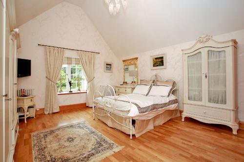 a bedroom with a bed and a large window at Luxury Scottish Apartment in Aberdeen