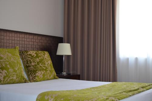 Hotel Torres Novasにあるベッド