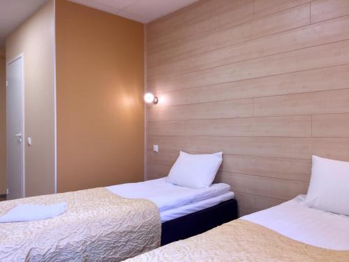 
Voodi või voodid majutusasutuse Center Hotel toas
