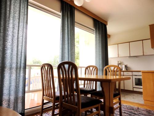 a kitchen and dining room with a table and chairs at Ferienwohnung Rogatsch in Sankt Kanzian