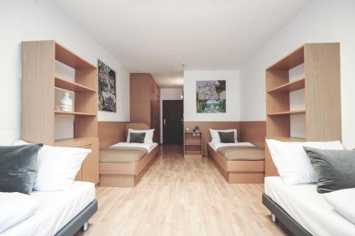 En eller flere senge i et værelse på myNext - Campus Hostel