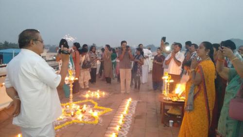a group of people standing around with lights at Ramana Towers in Tiruvannāmalai