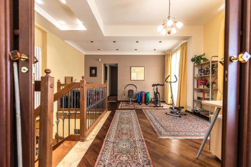 a living room with a staircase and a rug at Il Sorriso di Liu' in Agrigento