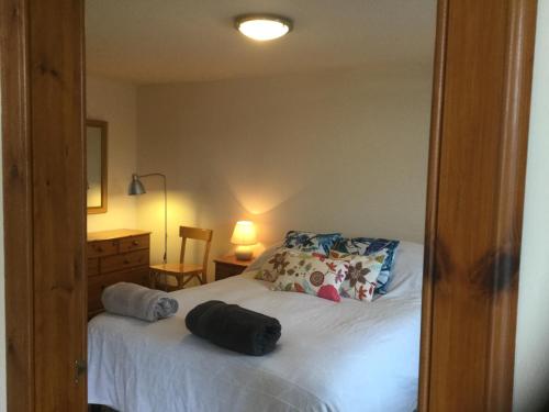 A bed or beds in a room at Oban Seil Farm The Bothy