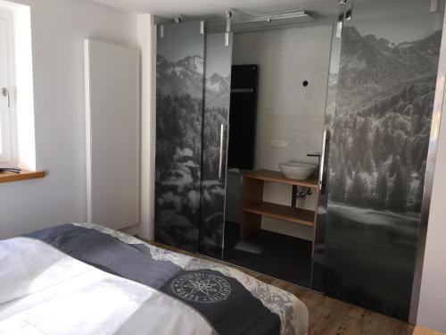 a bedroom with a shower and a bed in a room at Hotel Engel in Oberstdorf