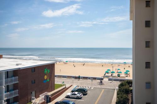 a view of the beach from a balcony of a building at The Spinnaker in Ocean City