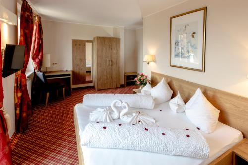 Ένα ή περισσότερα κρεβάτια σε δωμάτιο στο Hotel Stamserhof
