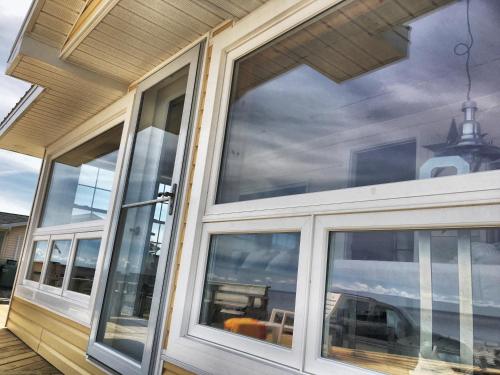 a large window on the side of a house at Chalet 44 in Grand Barachois