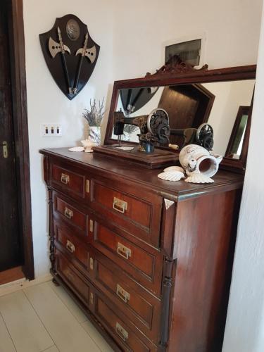 a dresser with a mirror on top of it at Apartment La-Vi in Stara Baška