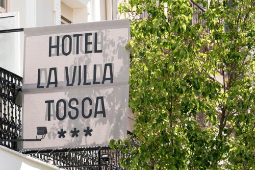 a sign for a hotel la villa toscega at Hôtel La Villa Tosca in Cannes