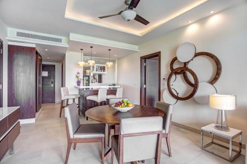 a dining room and kitchen with a table and chairs at Grand Lido Negril Au-Naturel, An Autograph Collection All-Inclusive Resort - Adults Only in Negril